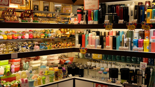 assorted bottles on glass shelf