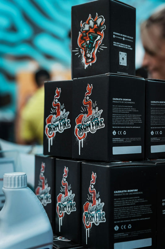 a stack of black boxes sitting on top of a table