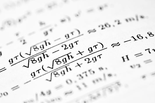 Mathematical formulas are shown on the paper